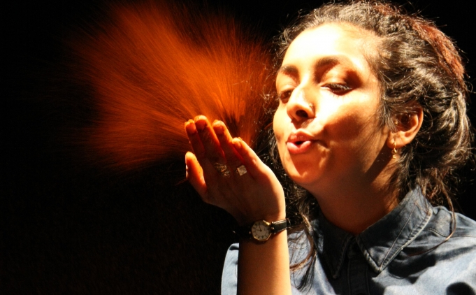 Image of woman blowing dust Afreena Islam's Daughters of the Curry Revolution 