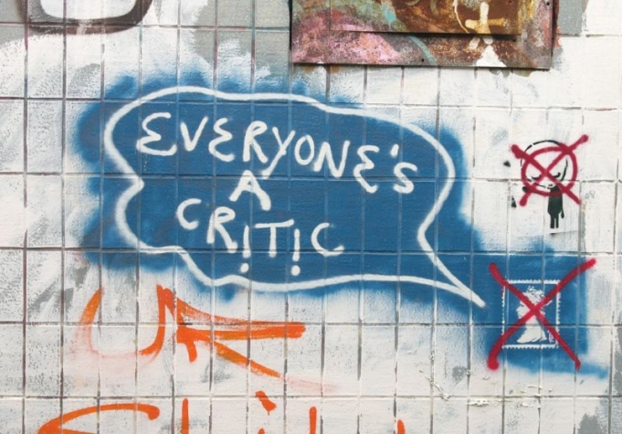 Graphic design of a sheet with notes and graffiti reading 'Everyone's a critic'