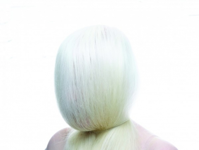 Image of (Alba long white hair covering face) photo credit manuel vason 