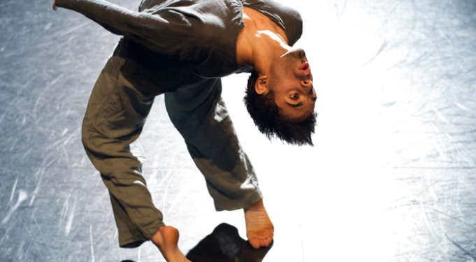 Image Aakash Odedra doing a backbend in Rising. photo: Chris Nash